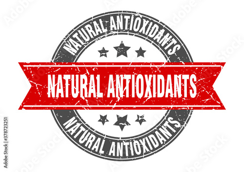natural antioxidants round stamp with ribbon. label sign