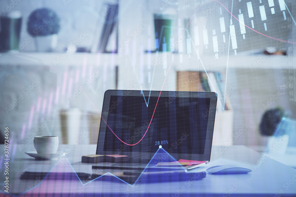 Forex Chart hologram on table with computer background. Double exposure. Concept of financial markets. Forex Chart hologram on table with computer background. Double exposure. Concept of financial markets.