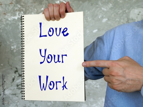 Business concept meaning Love Your Work with sign on the piece of paper.