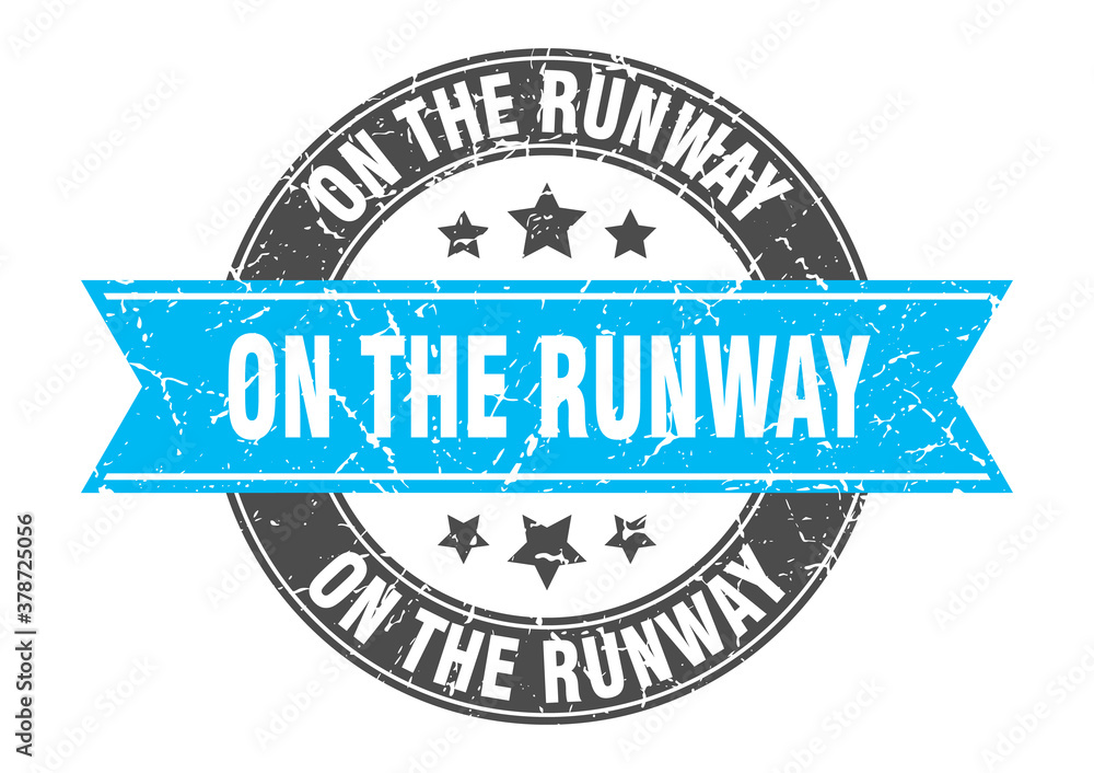 Obraz premium on the runway round stamp with ribbon. label sign