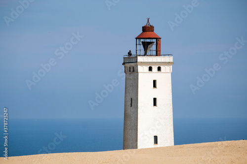 Famous Rubjerg Knude Fyr on the Dune Cliff of the northern Jutland, Denmark, Europe