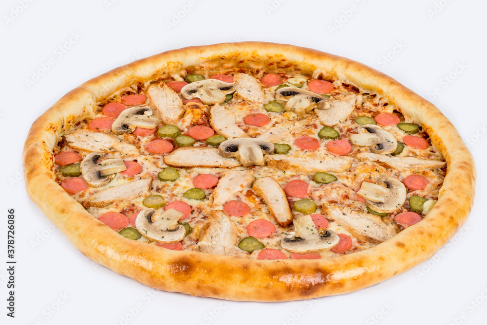 Pizza with mushrooms, pickles, sausage on a white plate