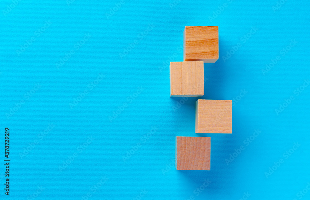 Top view of wooden toy blocks on blue Top view of wooden toy blocks on blue