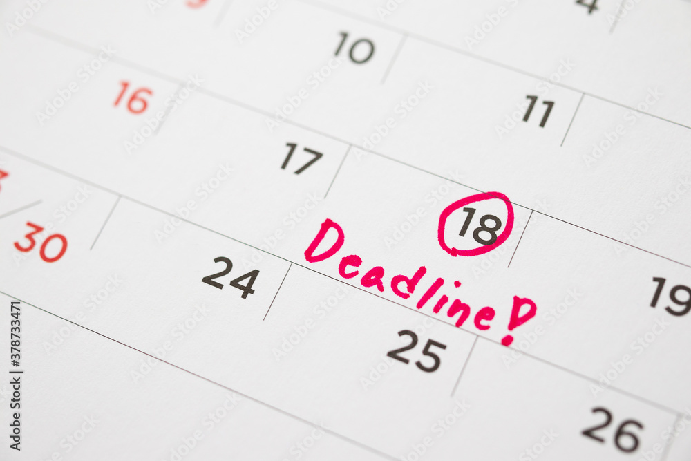 Deadline write on white calendar page date close up Deadline write on white calendar page date close up