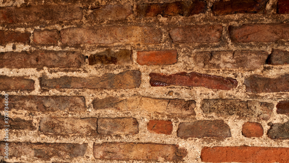 Naklejka premium Red old worn brick wall texture background. Vintage effect.