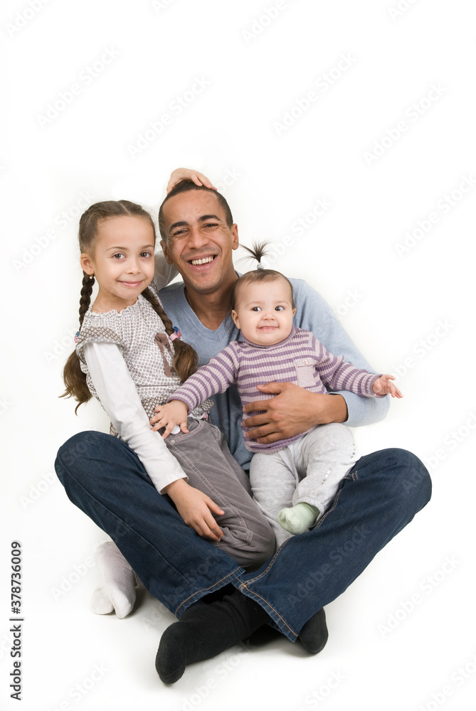 Multiracial family. Dad with two daughters