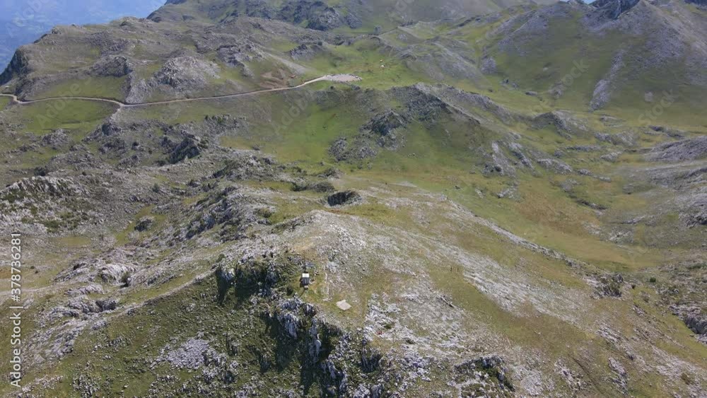 small antenna cluster on isolated mountain peak, drone pull back reveal shot small antenna cluster on isolated mountain peak, drone pull back reveal shot