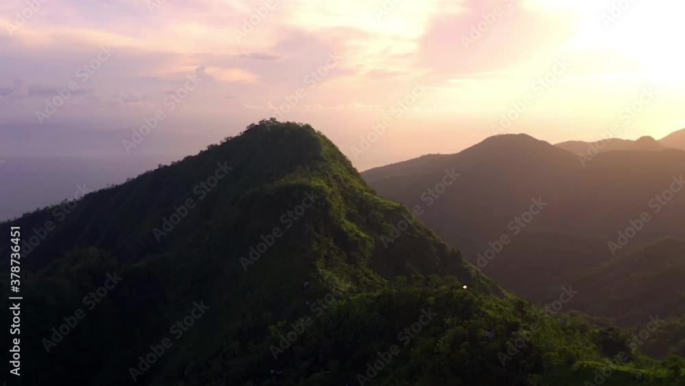 Amazing colorful sunrise near Lahangan Sweet in Bali, aerial forward