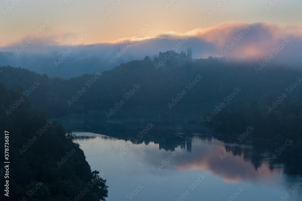 Cornstein Medieval castle in South Moravia region during amazing sunrise, Czech republic, Europe. Aerial drone view. Summer or autumn time. Misty and sunny atmosphere. Cornstein Medieval castle in South Moravia region during amazing sunrise, Czech republic, Europe. Aerial drone view. Summer or autumn time. Misty and sunny atmosphere.