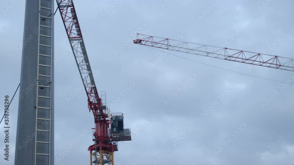 Close-up of some cranes. Nice composition. Early cloudy morning. Not working yet. Close-up of some cranes. Nice composition. Early cloudy morning. Not working yet.