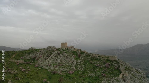 Aerial drone panoramic view video of historic uphill medieval castle of Acrocorinth an ancient citadel overlooking ancient Corinth with breathtaking view, Peloponnese, Greece photo