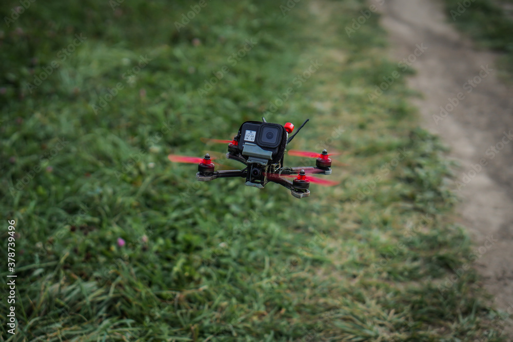 The flying racing drone is ready for the race. The flying racing drone is ready for the race.
