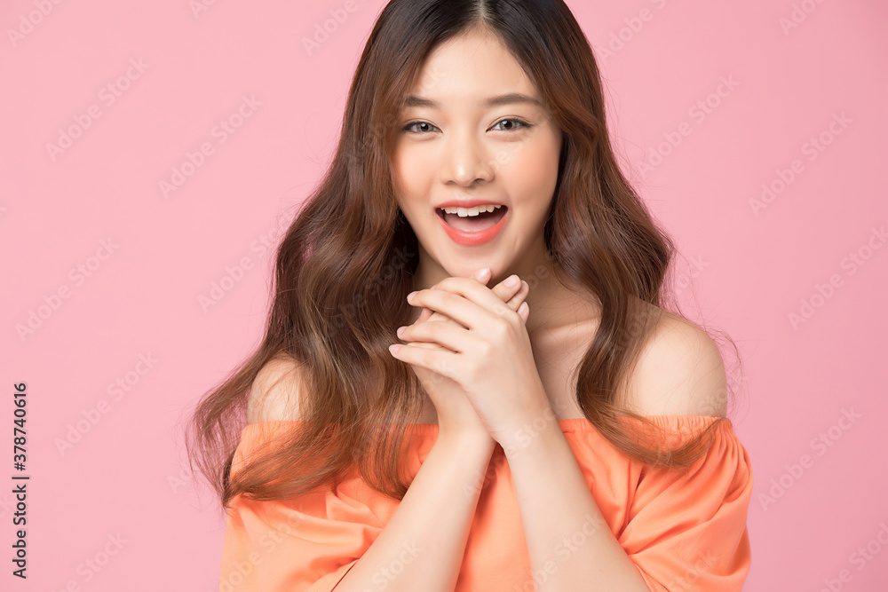 Portrait of beautiful woman posing gesture isolated on pink studio background Portrait of beautiful woman posing gesture isolated on pink studio background