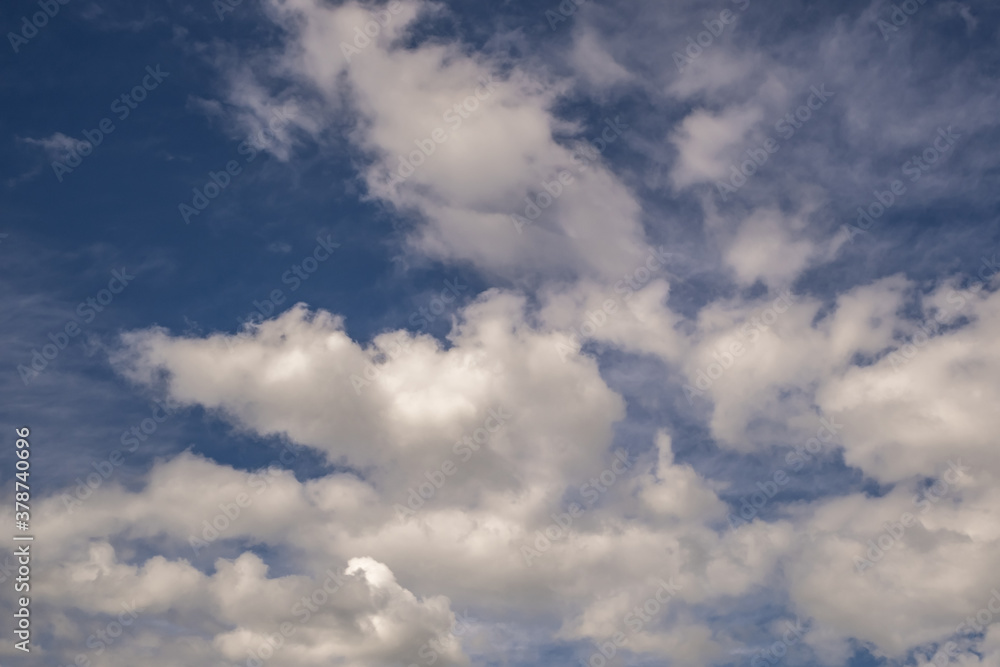 Blue sky background with white striped clouds. Clearing day and Good windy weather Blue sky background with white striped clouds. Clearing day and Good windy weather