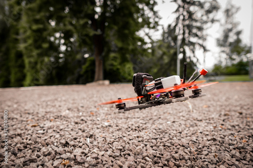 The flying racing drone is ready for the race.