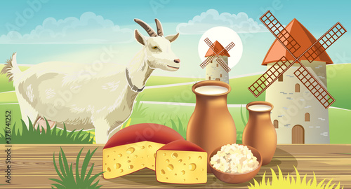 Goat on meadow with wind mills, near a table with cheese , cottage cheese and...