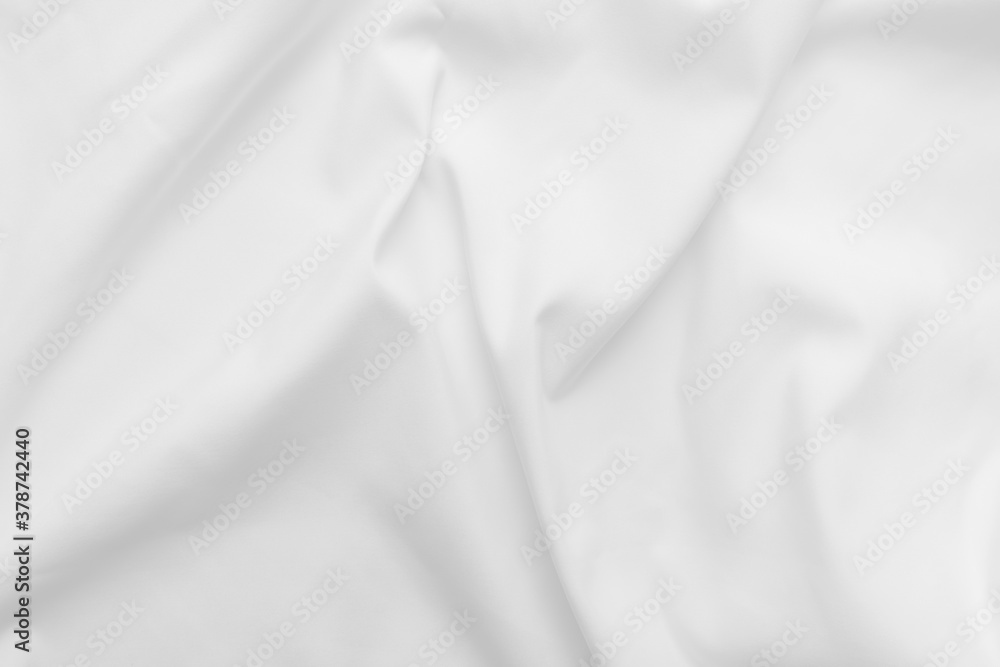Abstract white fabric texture background. Cloth soft wave. Creases of satin, silk, and cotton. Abstract white fabric texture background. Cloth soft wave. Creases of satin, silk, and cotton.