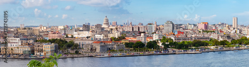Havana, Cuba-October 07, 2016. Close-up panorama view of historical old Havana city with famous buildings and monumets from Casablanka, the east of the entrance to Havana Harbor on October 07 2016. photo