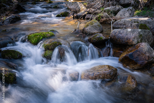 River water flows among the rocks and forms small waterfalls, Rascafría, Madrid, Spain