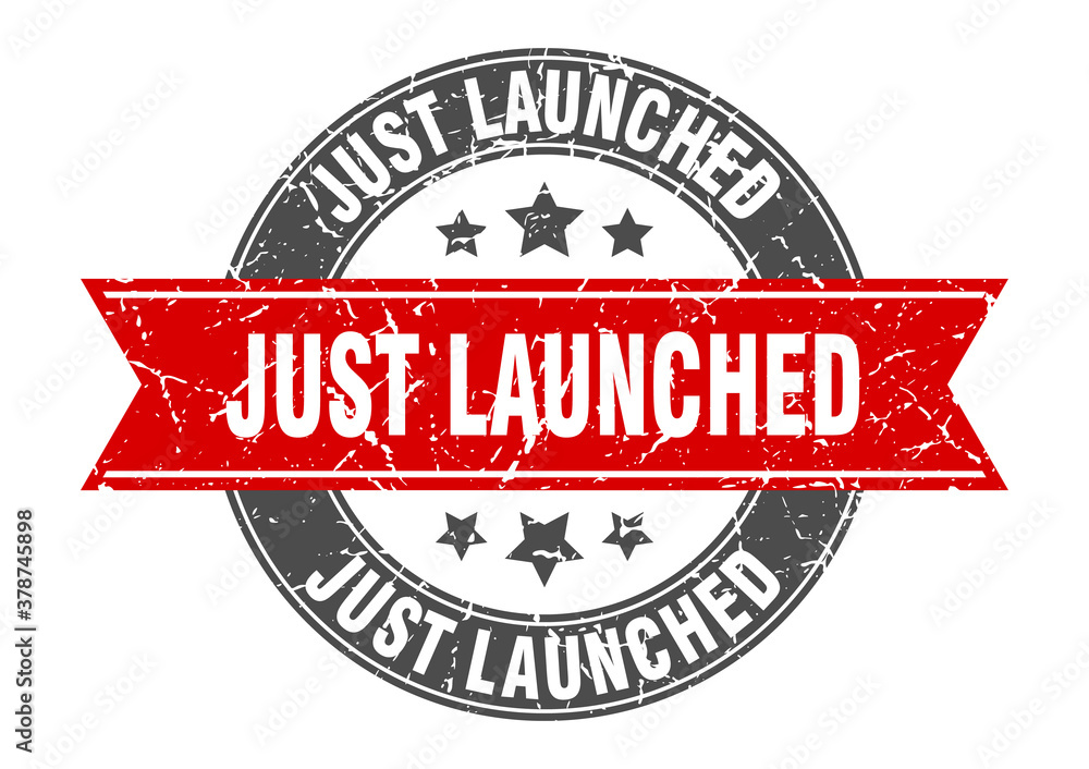 Fototapeta premium just launched round stamp with ribbon. label sign