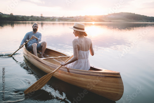 Couple paddling canoe 