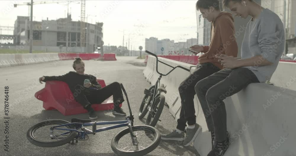 Tired bored friends with bikes Tired bored friends with bikes