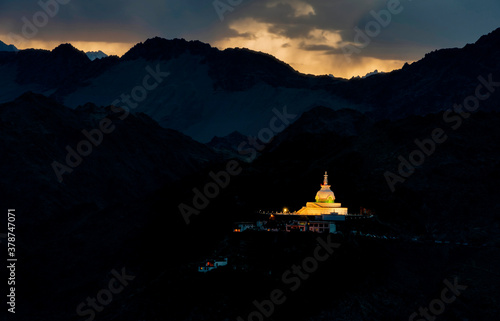 Shanti Stupa lit up  during Sunset  Ladakh  India. Holds relics of the Buddha at its base  enshrined by the 14th Dalai Lama.