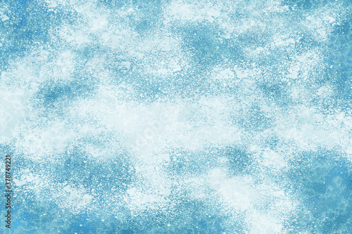 Abstract frosty pattern on glass and Snow background. Frost texture iced surface, Winter material. Frosted glass texture. Blue foil freeze gradient texture background. The frozen water. Winter and Sno