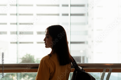 Back view - University student holding a bag. Free Download Back view - University student holding a bag. - GFXLoad