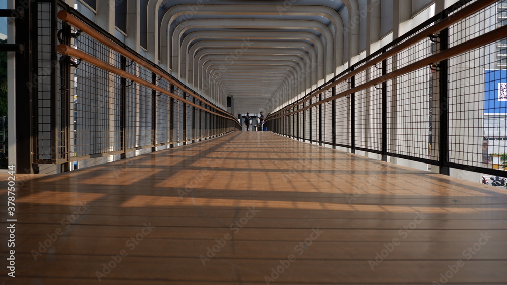 Low angle view of pedestrian bridge in the center of business and office in Jakarta Low angle view of pedestrian bridge in the center of business and office in Jakarta