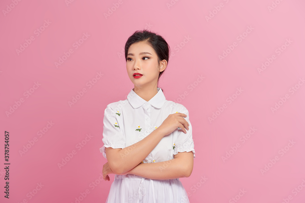 Blithesome woman in white blouse looking up with smile Blithesome woman in white blouse looking up with smile