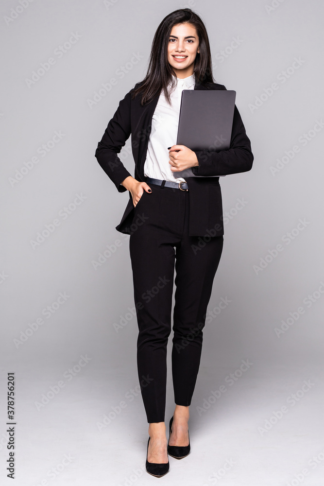 Full length young business woman standing with her clipboard isolated on white background Full length young business woman standing with her clipboard isolated on white background