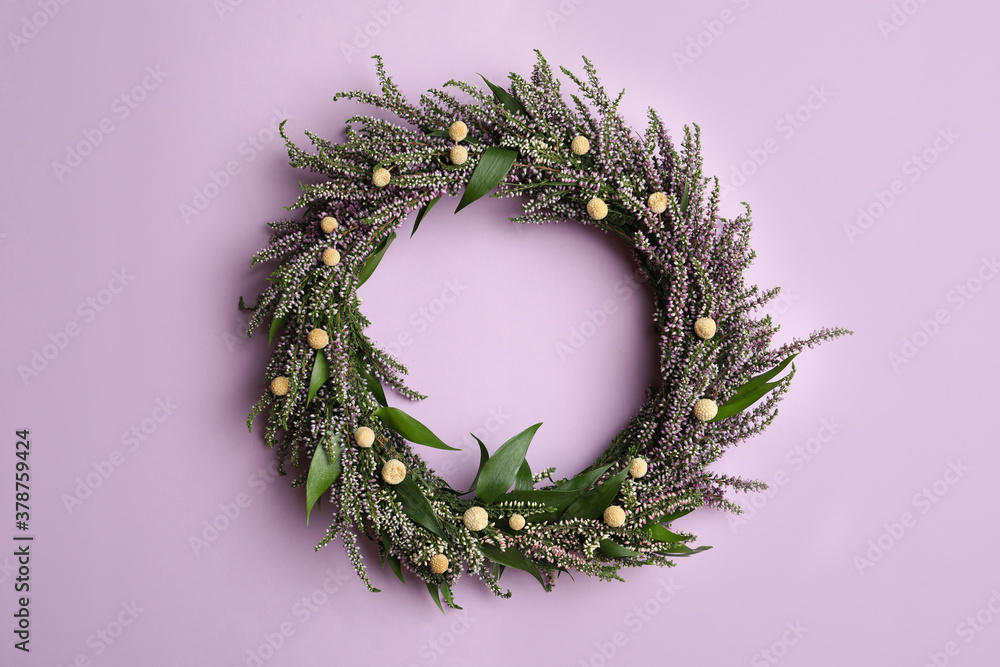 Beautiful heather wreath on violet background, top view. Autumnal flowers Beautiful heather wreath on violet background, top view. Autumnal flowers