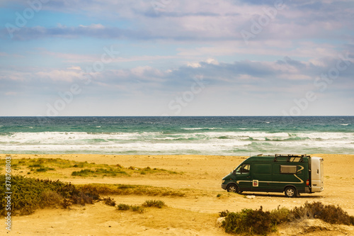 Camper van on beach in Spain.