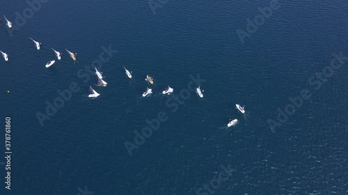 Time lapse of a sailing race in a lake.