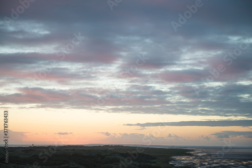 Sunrise in the beautiful protected nature area Het Oerd on the Wadden island of Ameland in the Netherlands  beautiful golden light in the early morning