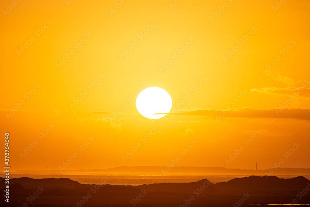 Sunrise in the beautiful protected nature area Het Oerd on the Wadden island of Ameland in the Netherlands, beautiful golden light in the early morning