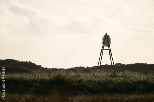  The beacon on Amelend, A cape or sea cape is a beacon for shipping and is a striking landmark in the landscape. on the beautiful Oerd, protected nature area on Ameland, the Netherlands