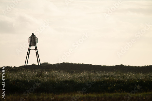  The beacon on Amelend, A cape or sea cape is a beacon for shipping and is a striking landmark in the landscape. on the beautiful Oerd, protected nature area on Ameland, the Netherlands