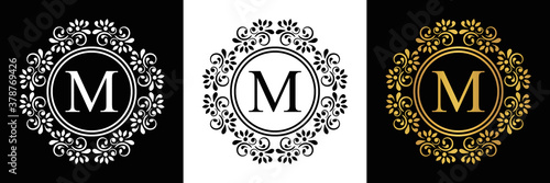  Gold letter  M Vintage set black, white and golden flower ornament initial letters.  Alphabet. Logo vector 