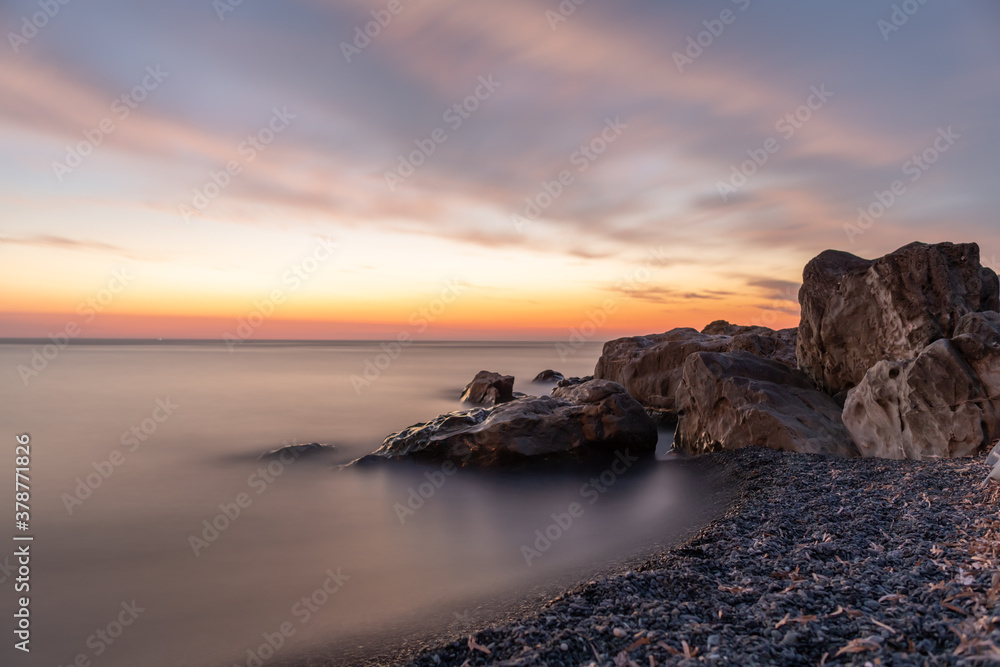 Long exposure of the sea after sunset, on the coast of Corsica, France.