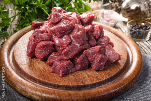 Beef stew prepared on a chopping board.