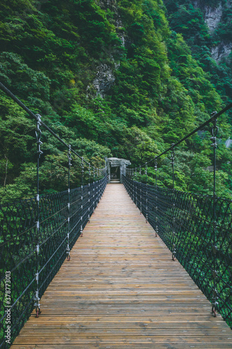 Fototapeta Naklejka Na Ścianę i Meble -  Hanging bridge across valley on Wugong Mountain in Jiangxi, China