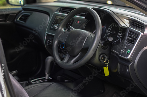 Modern car interior. Steering wheel, close-up © Muanpare