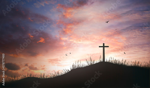 Obraz na plátně Religious concept: Silhouette cross and birds flying on  sunrise background