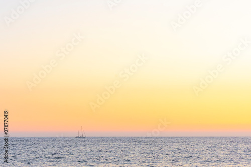 Lone Yacht on the Ocean at Sunset - Bantham  Devon  England