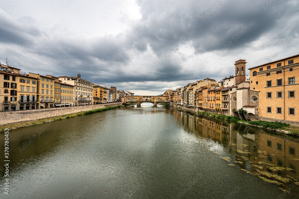 Florence cityscape with the famous Ponte Vecchio (Old Bridge) and the River Arno, view from the bridge of Santa Trinita. Tuscany Italy, Europe