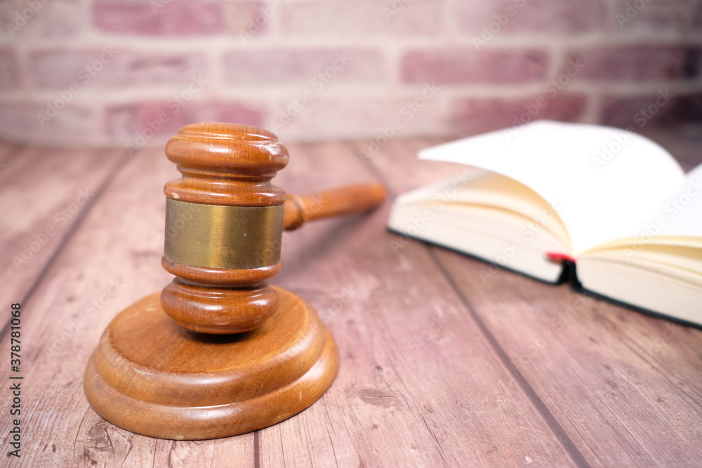 Close up of gavel and a book on table Close up of gavel and a book on table
