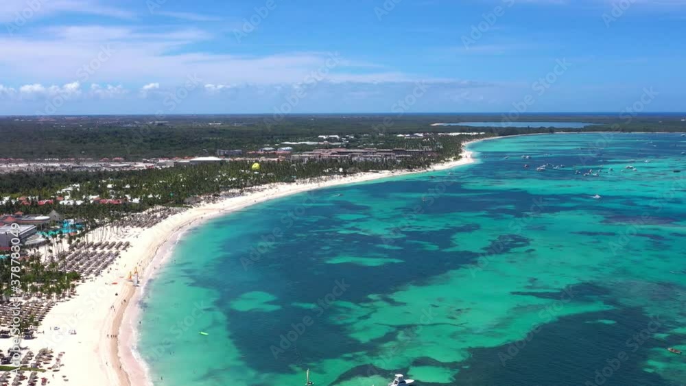 Aerial view on tropical island with resorts and boats floating in caribbean sea. Travel destinations. Summer vacation Aerial view on tropical island with resorts and boats floating in caribbean sea. Travel destinations. Summer vacation