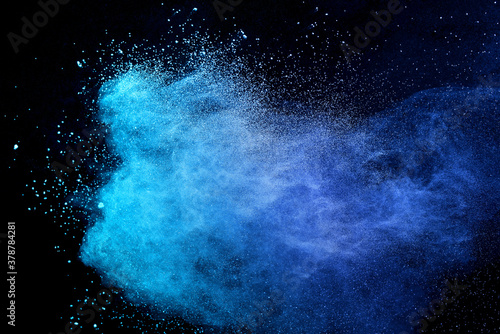 Blue sky color powder explosion on black background. photo